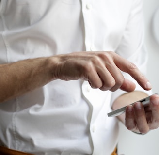 person holding white Android smartphone in white shirt