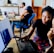 woman and man sitting in front of monitor